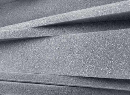pile of gray sponge foam material with different thicknessの写真素材