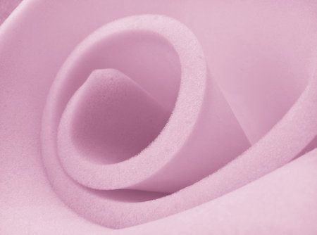 light purple sponge foam texture made in the form of a spiral spiral rollの写真素材