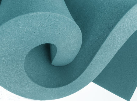 blue thick foam sheet rolled up in spiral style isolated on white background