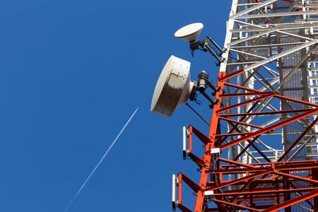 A cell site, cell tower, or cellular base station is a cellular-enabled mobile device site where antennae and electronic communications equipment are placed to create a cell in a cellular networkの写真素材