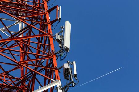 A cell site, cell tower, or cellular base station is a cellular-enabled mobile device site where antennae and electronic communications equipment are placed to create a cell in a cellular networkの写真素材
