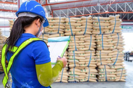 stacked sacks in store. A warehouse is a commercial building for storage. Warehouses are used by manufacturers, importers, exporters, wholesalers, 
transport businesses before distribution to the buyerの写真素材