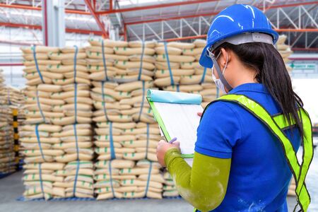 stacked sacks in store. A warehouse is a commercial building for storage. Warehouses are used by manufacturers, importers, exporters, wholesalers, 
transport businesses before distribution to the buyerの写真素材