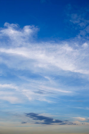 Skyscape with White, fluffy clouds in blue sky. Background for website and design assetの写真素材