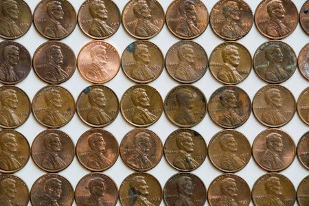 One shiny penny in a group of others.の写真素材