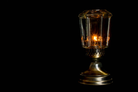 An oil lamp on a black background.の写真素材