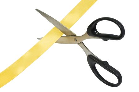 Grand Opening scissors cutting a golden ribbon