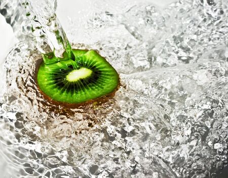 Fresh kiwi under waterの写真素材