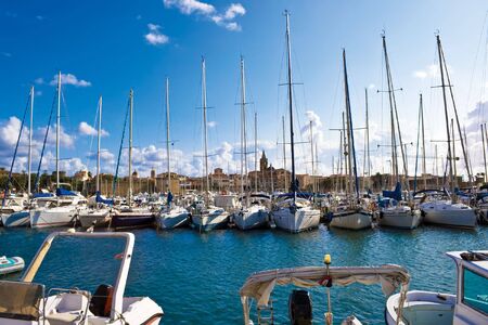 Classic white yachts ancored in Alghero, Sardiniaの写真素材