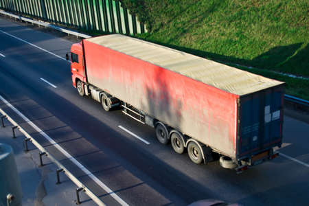 Red truck on a highwayの写真素材