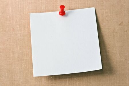Note white paper tacked on a wallの写真素材