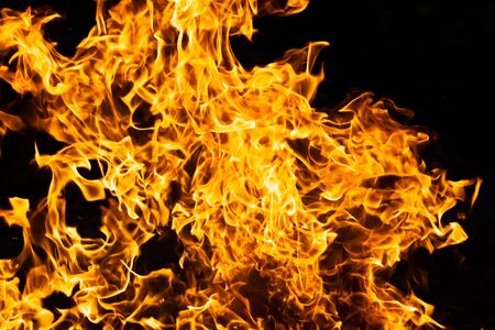 Orange flame burning on black background