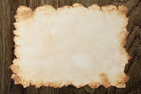 Nice aged paper on wooden backgroundの写真素材