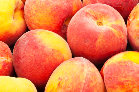 Fresh sweet red peaches making nice background