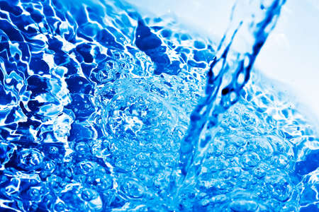 Blue transparent water splashes on white background