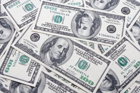 Lots of dollar notes arranged in chaotic manner, backgroundの写真素材