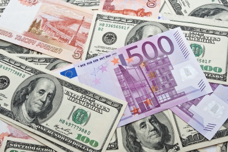 Lots of dollar and euro notes arranged in chaotic manner, backgroundの写真素材