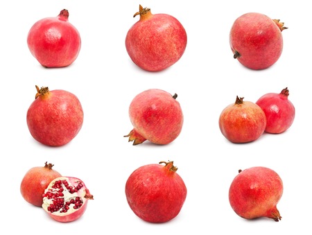 Collection of red pomegranates isolated on white backgroundの写真素材