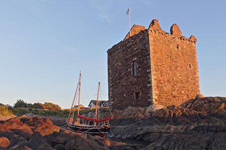 Portencross castle with small boatのeditorial素材