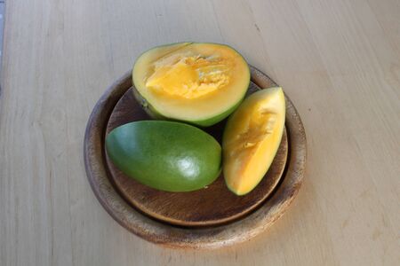 Cut mango on board.の写真素材