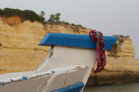 Bandanna hanging on the bow of distressed boat.の写真素材