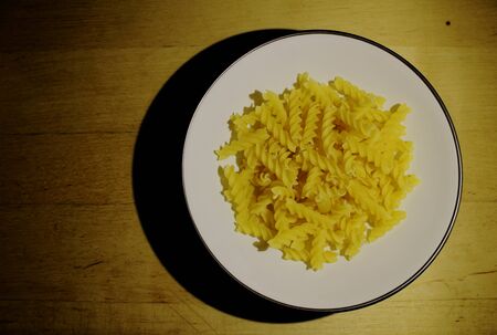 bowl of Fusilli pasta.の写真素材
