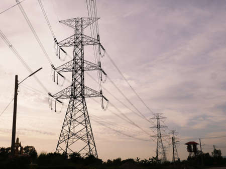 High-voltage poles to produce electricity for the communityの写真素材