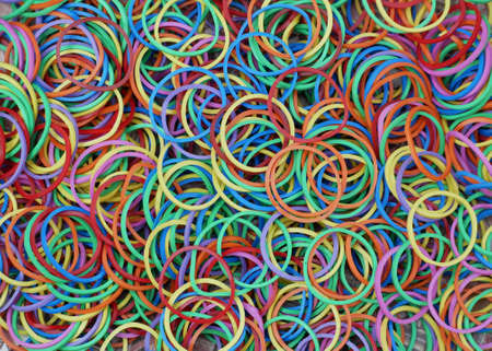A small rubber band in various colors, put together.