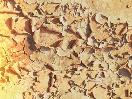 The ground is dry and split and broken.