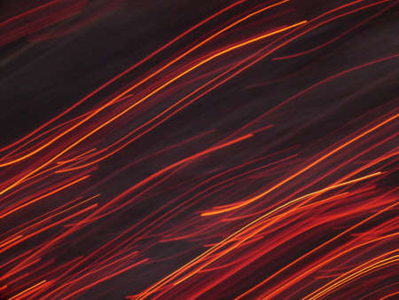 Fire flames with sparks on a black background.By shooting at high speed.