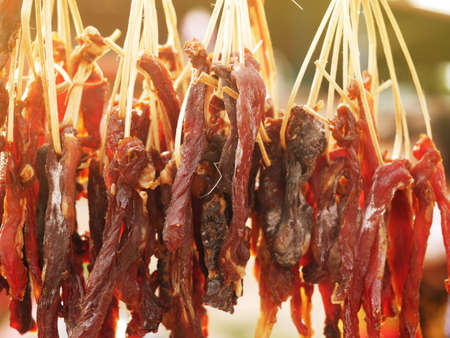 The dried beef is laid out in a row to spread.の写真素材