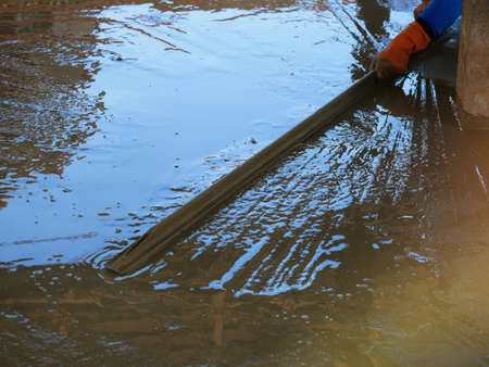 Plasterers are using equipment to smooth the plaster.の写真素材