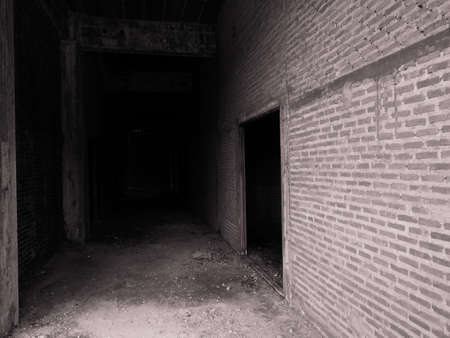The brick walls of the old abandoned buildings are scary.の写真素材