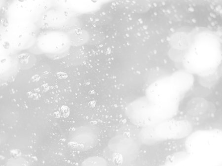 The illuminated white bokeh image can be used as a background illustration or add text.の写真素材