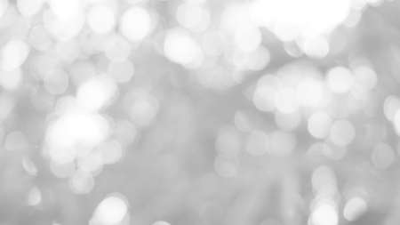 The illuminated white bokeh image can be used as a background illustration or add text.の写真素材