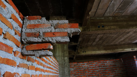 Close-up of the rubble of an industrial building collapsing into a pile of concrete and brick. and the jagged debris caused by the failure of the engineers at the abandoned construction.の写真素材