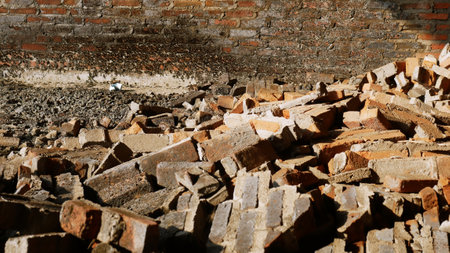 Close-up of the rubble of an industrial building collapsing into a pile of concrete and brick. and the jagged debris caused by the failure of the engineers at the abandoned construction.の写真素材