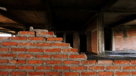 Close-up of the rubble of an industrial building collapsing into a pile of concrete and brick. and...