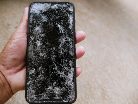 The smartphone hit the floor, it fell into a crack.