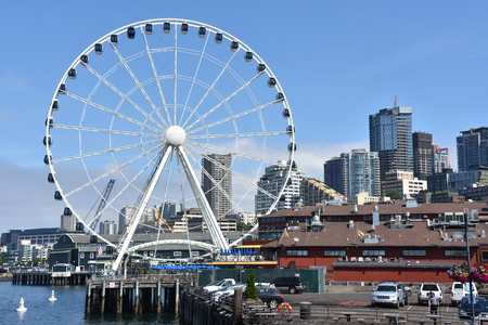 SEATTLE, WA - JUL 15: View of The Seattle Great Wheel at Pier 57 in Seattle, Washington, on July 15, 2019. With an overall height of 175 feet, it was the tallest Ferris wheel on the West Coast of USA.のeditorial素材