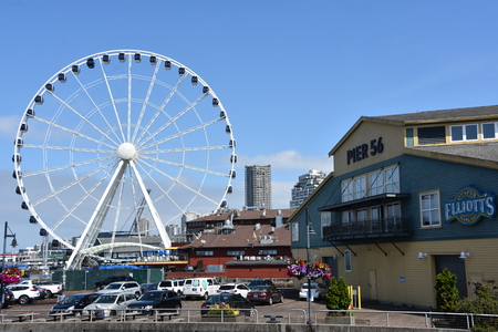 SEATTLE, WA - JUL 15: View of The Seattle Great Wheel at Pier 57 in Seattle, Washington, on July 15, 2019. With an overall height of 175 feet, it was the tallest Ferris wheel on the West Coast of USA.のeditorial素材