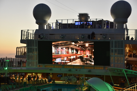 SAN DIEGO, CA - OCT 24: Pool deck on the Norwegian Bliss cruise ship, docked in San Diego, California, on Oct 24, 2018. The ship entered service on April 21, 2018.のeditorial素材