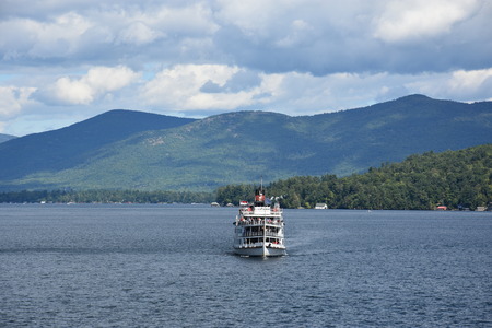 LAKE GEORGE, NY - SEP 24: Cruises around Lake George in New York State, as seen on Sep 24, 2016. The lake lies within the upper region of the Great Appalachian Valley and drains all the way northward into Lake Champlain and the St. Lawrence River drainageのeditorial素材