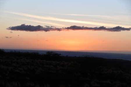 Sunset over the Pacific Ocean in Kailua Kona in Hawaiiの写真素材