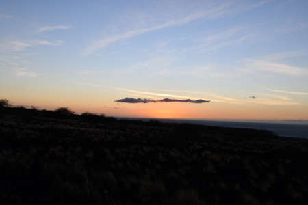 Sunset over the Pacific Ocean in Kailua Kona in Hawaiiの写真素材