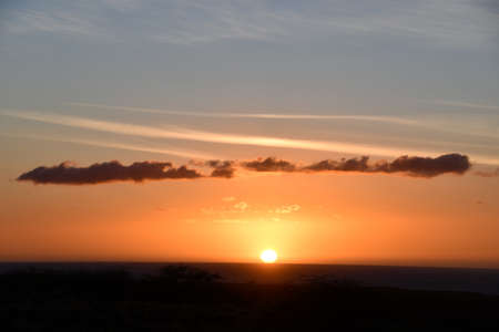 Sunset over the Pacific Ocean in Kailua Kona in Hawaiiの写真素材