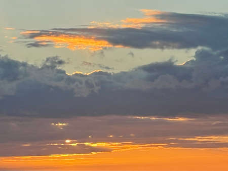 Sunset over the Pacific Ocean in Kailua Kona in Hawaiiの写真素材