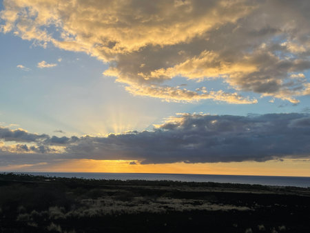 Sunset over the Pacific Ocean in Kailua Kona in Hawaiiの写真素材