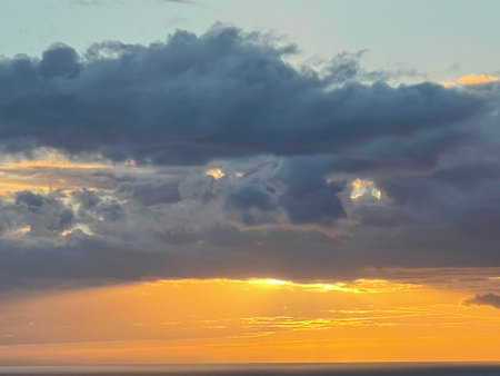 Sunset over the Pacific Ocean in Kailua Kona in Hawaiiの写真素材