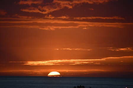 Sunset over the Pacific Ocean in Kailua Kona in Hawaiiの写真素材